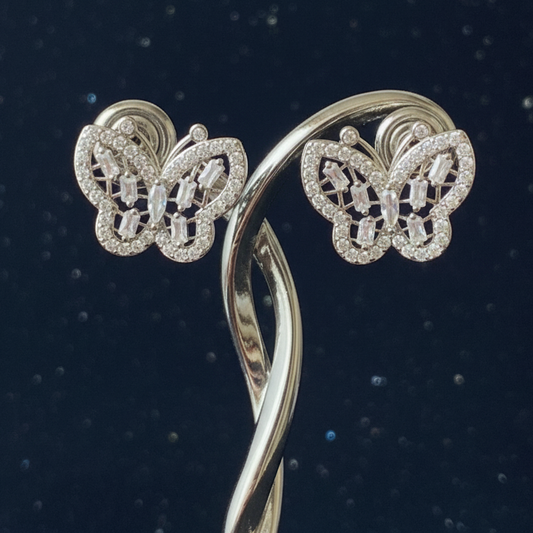 Clear crystal butterfly earrings on elegant stand