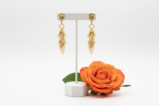 Gold leaf dangle earrings pair with orange rose