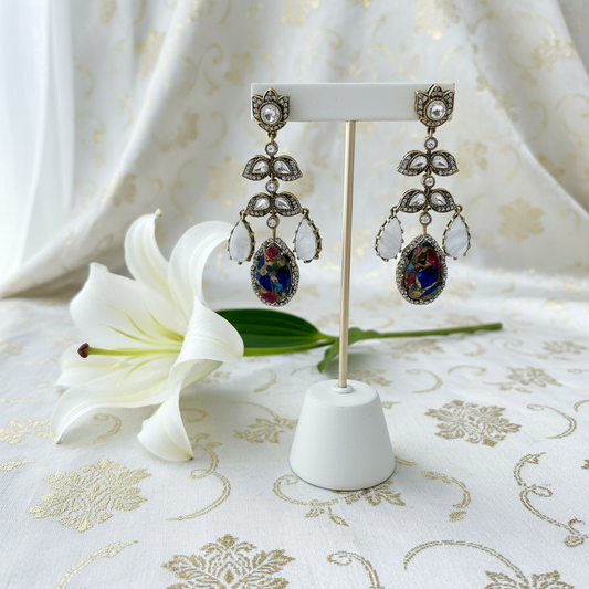 Moonstone earrings on holder with lily