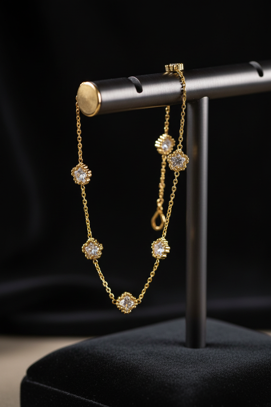 Quatrefoil clover charm anklet on display