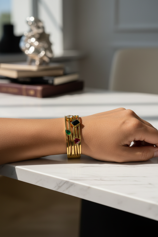 Your wrist wearing gold multi-band cuff with gemstones - elegant setting