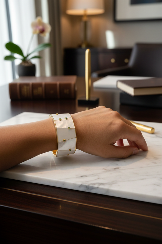 Your wrist wearing white enamel cuff with emeralds - elegant setting